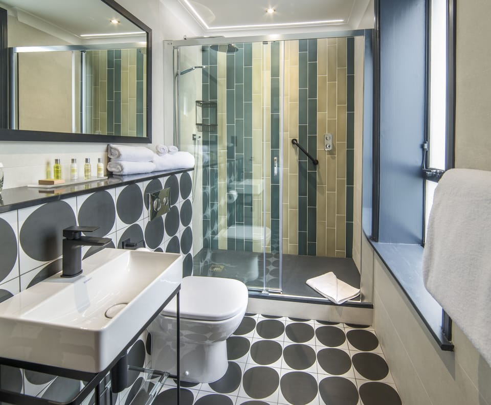 Shower, rainfall showerhead, hair dryer, towels