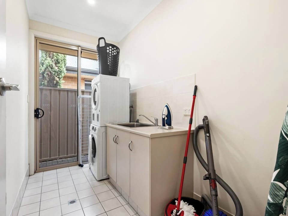 Fully equipped laundry with 7.5kg front loader washing machine, dryer, laundry basket, pegs, clothes airer, iron, ironing board, vacuum cleaner, mop and bucket and full size sink for all your cleaning needs. 
