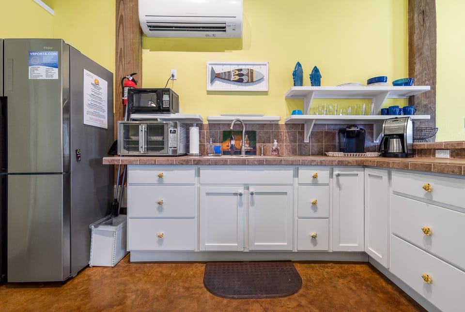 Full size refrigerator (no ice maker), microwave, convection oven