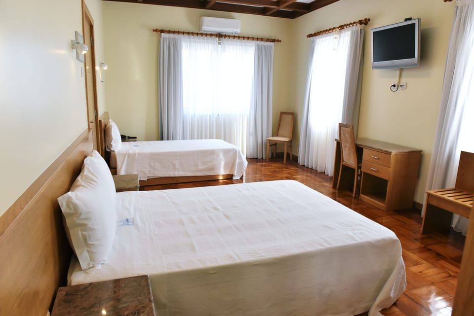 Basic Triple Room | Minibar, in-room safe, soundproofing, free WiFi