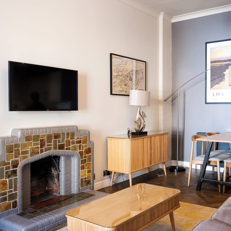 Standard Apartment, 1 Bedroom | Living area | Flat-screen TV, video-game console