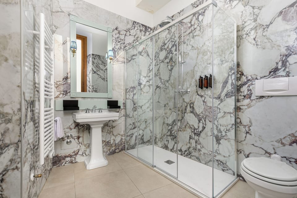 Eco-friendly toiletries, hair dryer, bidet, towels