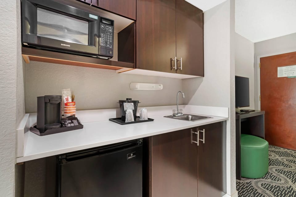 Suite, Non Smoking (2 Queen, 2 Person Sofabed) | Desk, laptop workspace, blackout drapes, iron/ironing board