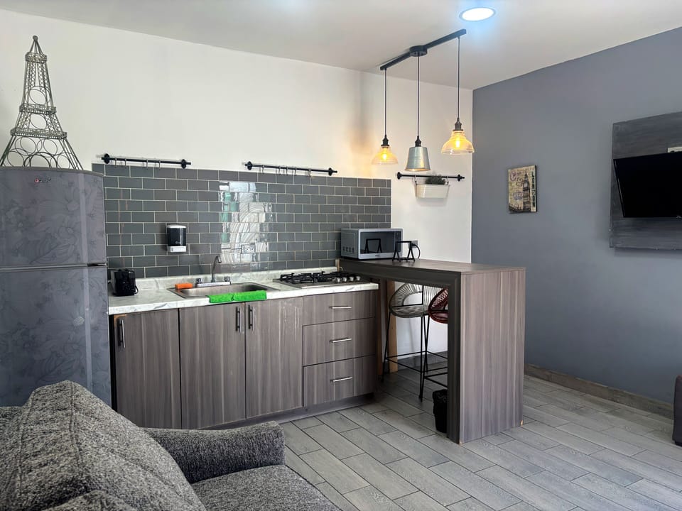 Nice & Cozy 1B TJ Border Suites 08 | Private kitchen | Full-size fridge, microwave, coffee/tea maker, toaster