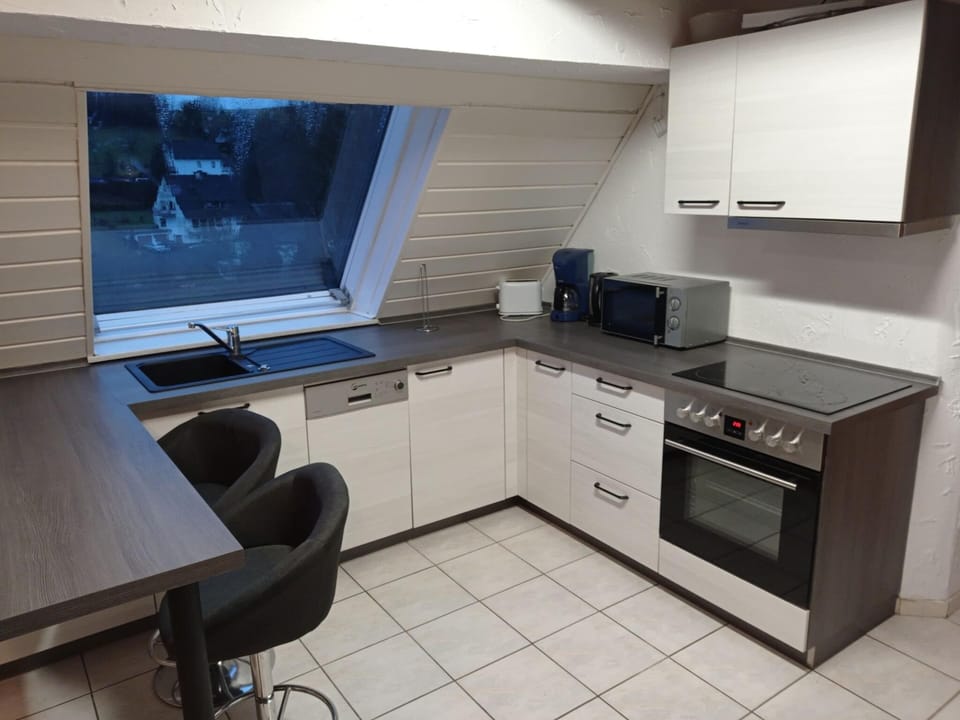Apartment | Private kitchen | Stovetop, coffee/tea maker, highchair