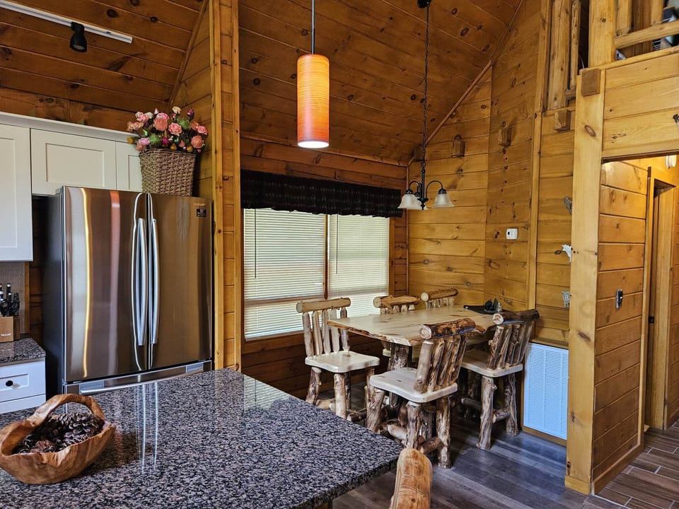 5 Seat Dining Area.  2 more seats at Kitchen Island.  Two picnic tables outside