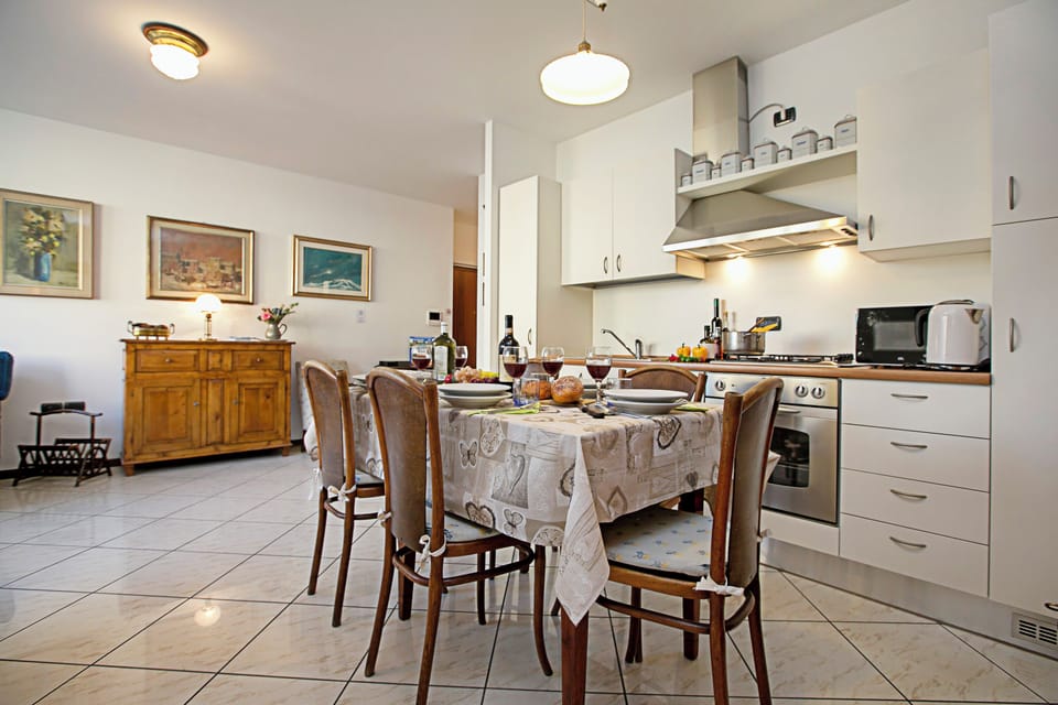 Family Apartment, Multiple Bedrooms (Riva Centro Apartment) | Private kitchen | Full-size fridge, microwave, oven, stovetop