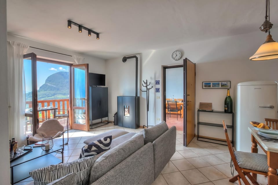 Family Apartment, Multiple Bedrooms, Mountainside (Balcone sul Lago) | Living area | Flat-screen TV