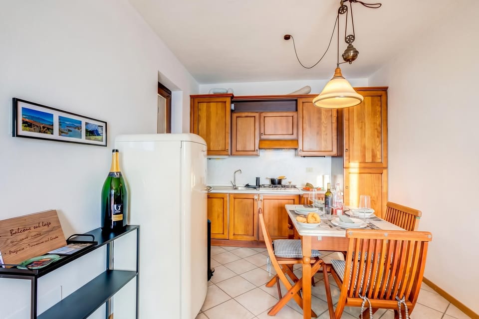 Family Apartment, Multiple Bedrooms, Mountainside (Balcone sul Lago) | Private kitchen | Full-size fridge, microwave, oven, stovetop