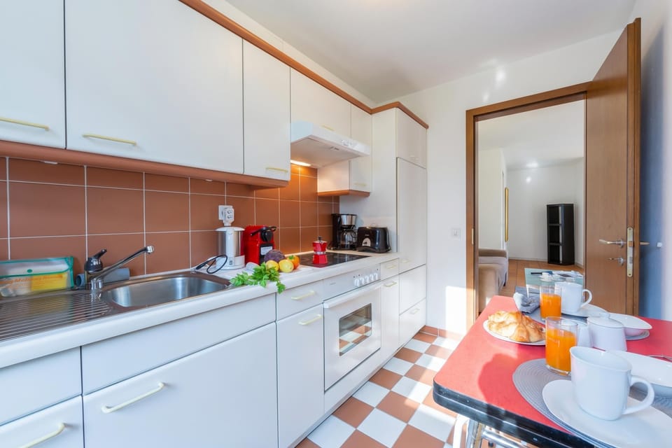 Family Apartment, 1 Bedroom, Balcony (Casa Chiara Muralto) | Private kitchen | Full-size fridge, microwave, oven, stovetop