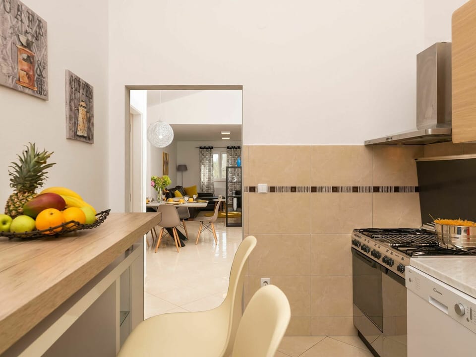 Furniture, Property, Picture Frame, Cabinetry, Gas Stove, Orange, Cooktop, Flooring, Interior Design, Floor