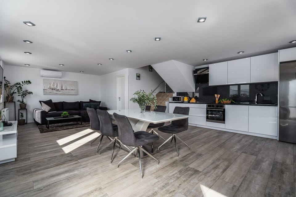 Connected dining and living area with sea views,fully equipped kitchen, bathroom