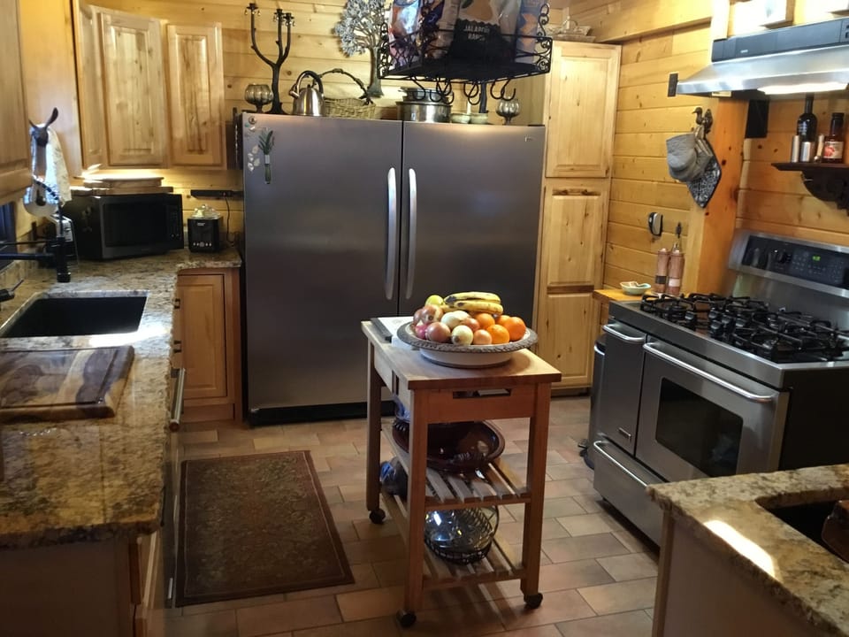 Gourmet Kitchen with all utensils, spices, and cookware.