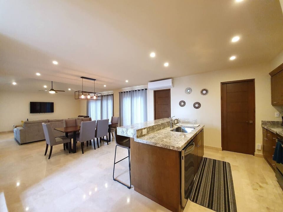 Enjoy home-cooked meals in a spacious kitchen and dining area.