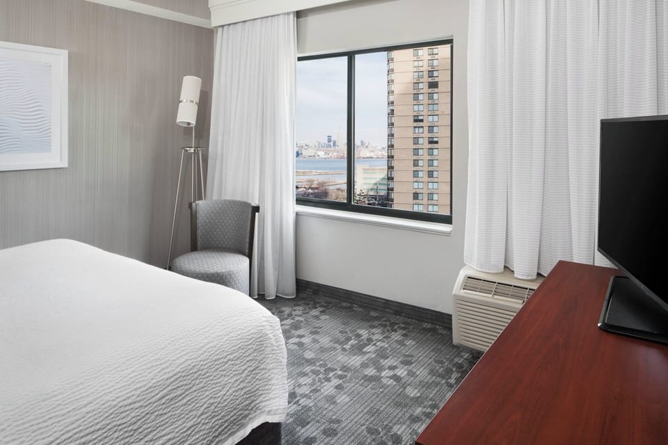 Suite, 1 Bedroom | Desk, laptop workspace, blackout drapes, iron/ironing board