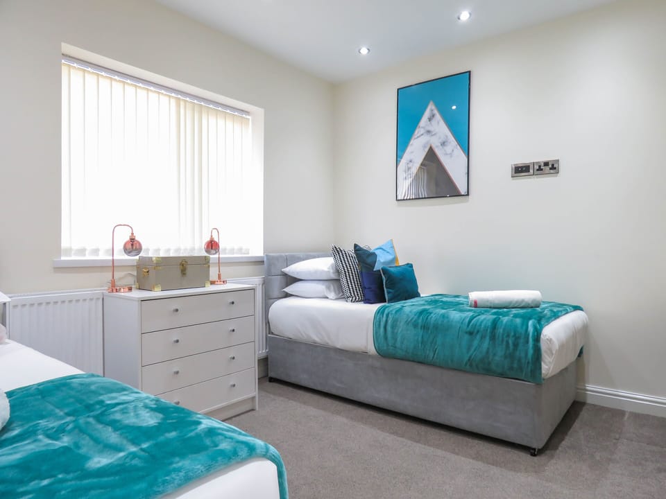 Business Townhome | 4 bedrooms, Egyptian cotton sheets, premium bedding, blackout drapes