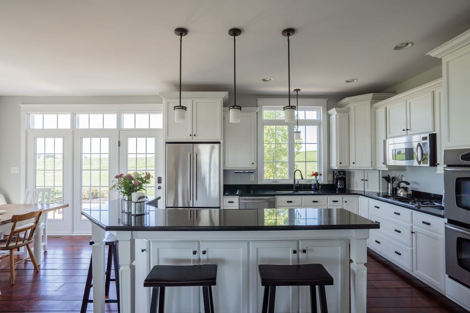 Fully stocked kitchen with double ovens. 