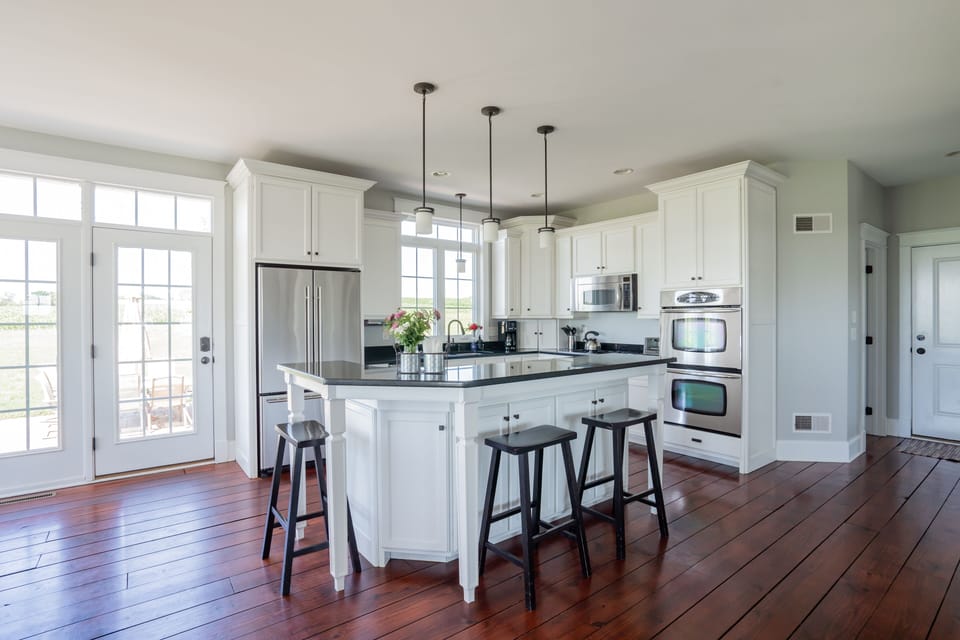 Fully stocked kitchen with double ovens. 