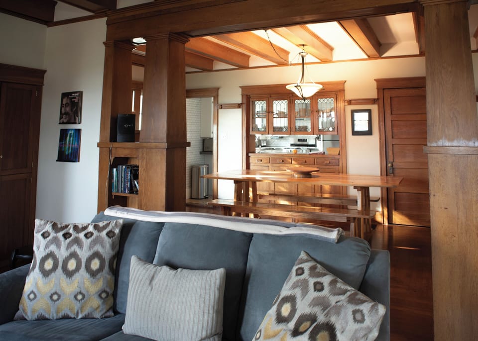 Open concept main floor with charming original Craftsman woodwork