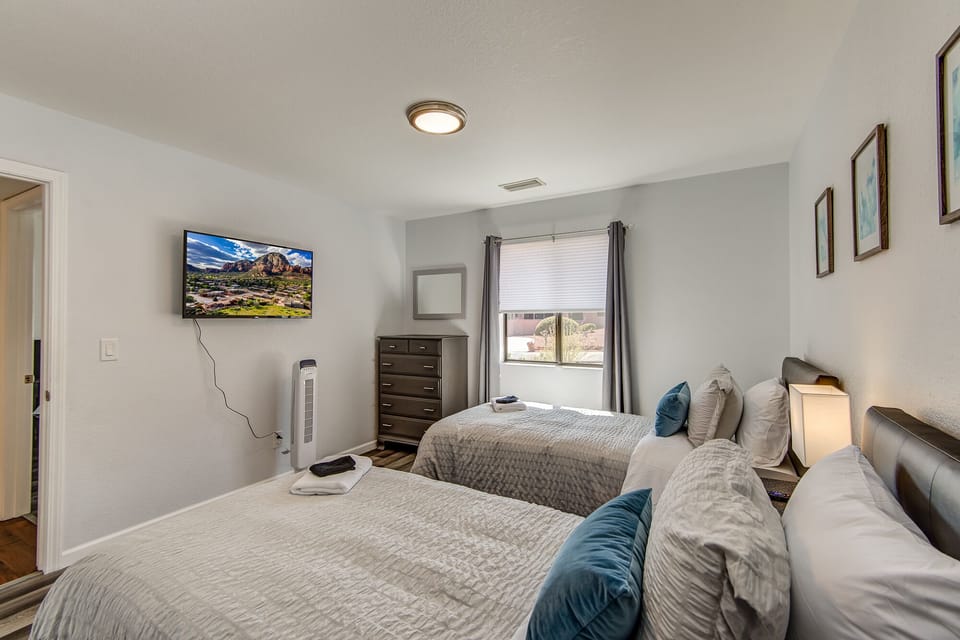 Bedroom 3 with Two Twin Beds,  43" Smart TV, and Full Shared Bath Access