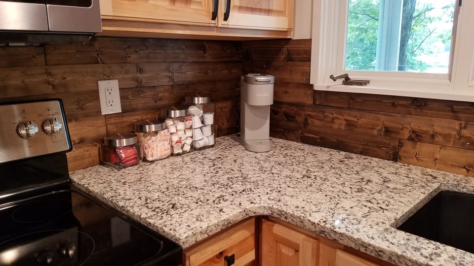 Keurig with coffee supplies. 
