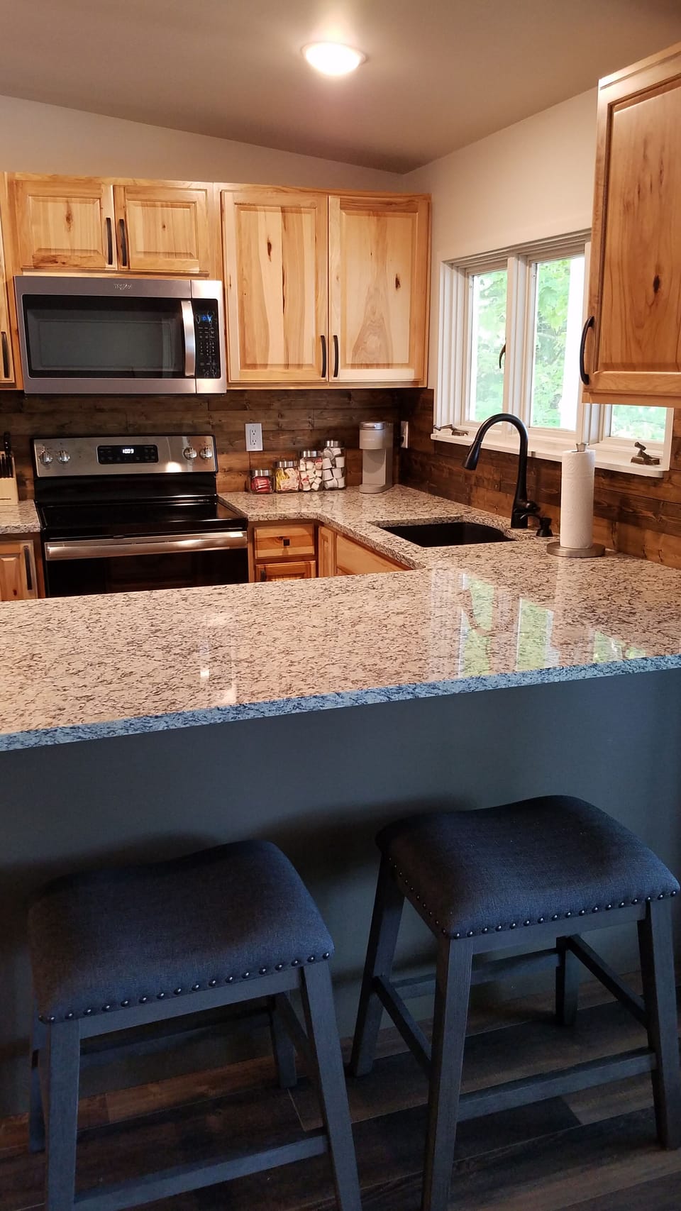 Keurig, toaster, place setting for 6, dishware, wine glasses, grilling utensils.