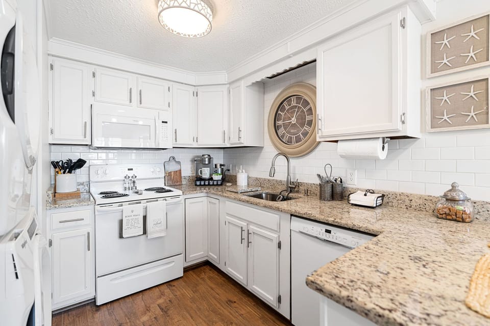 Kitchen area with plenty of appliances.