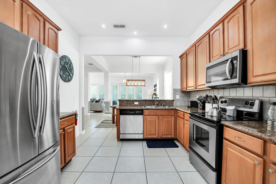 A second perspective of the kitchen showcasing extensive countertop space—ideal for group breakfasts, buffet-style meals
