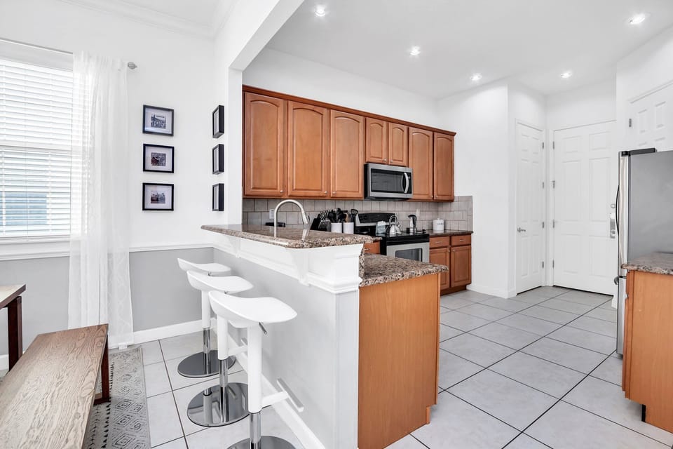 Cozy breakfast bar seating that keeps everyone connected whether you’re sipping morning coffee or late-night treats.

