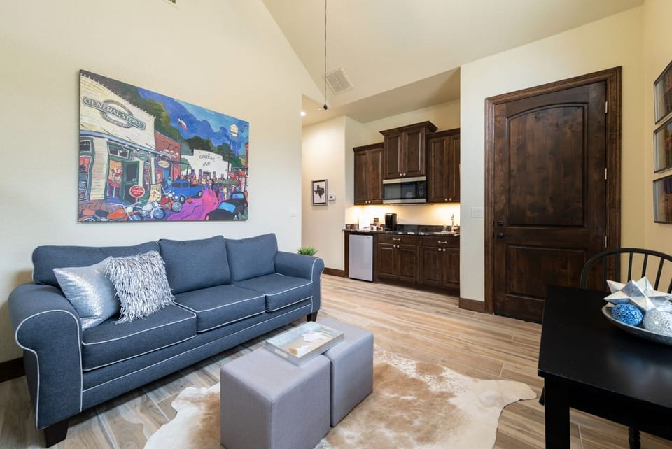 This is the living room , it has a sleeper sofa, Smart TV  & electric fireplace