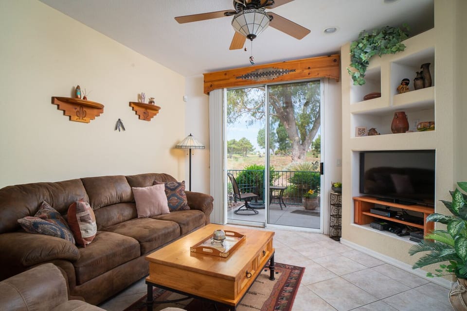 Living room has large floor to ceiling sliding doors, with view of GC. 