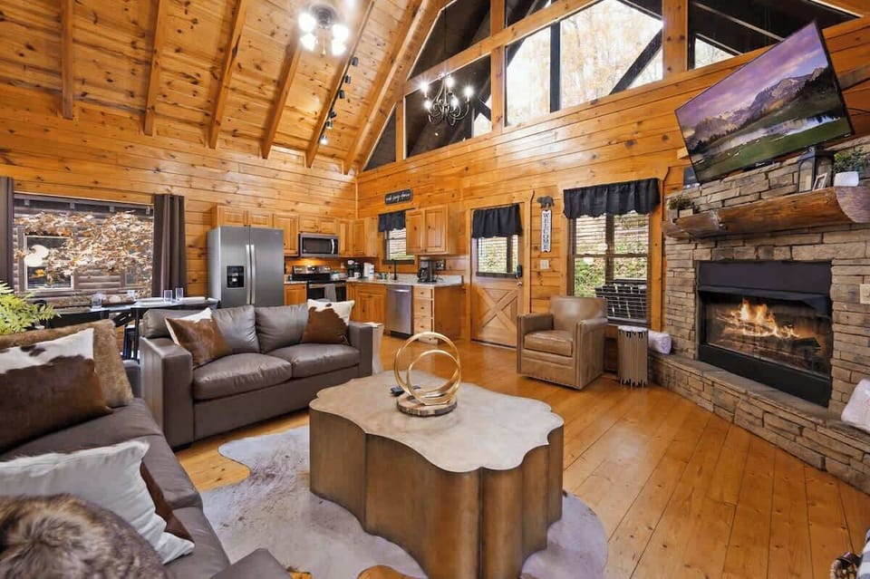 Living room with lots of windows that maximize sunlight. The picture doesn't do justice to the feeling of walking into this living room. It's simply beautiful.
