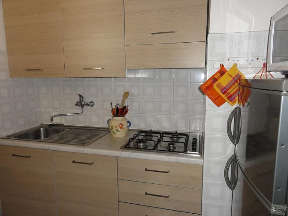 Apartment, 2 Bedrooms (A50248) | Private kitchenette | Full-size fridge, microwave, stovetop, cookware/dishes/utensils