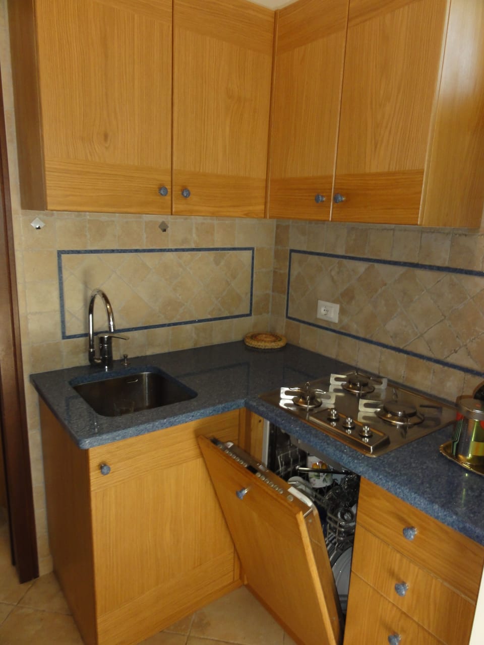 Full-size fridge, stovetop, cookware/dishes/utensils