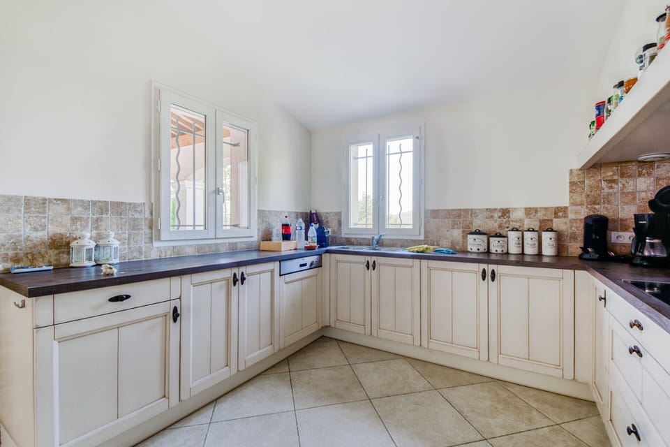Villa | Private kitchen | Fridge, highchair