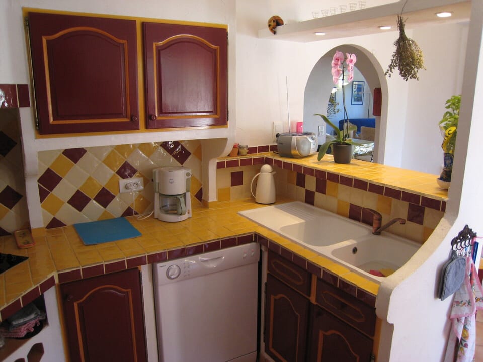 Villa | Private kitchen | Fridge, highchair