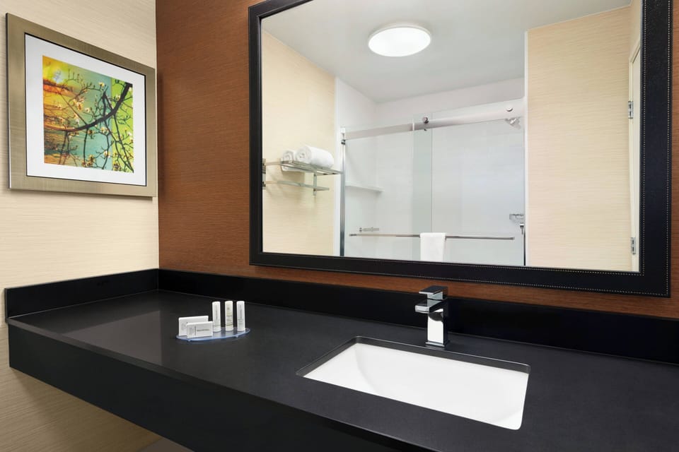 Combined shower/tub, hair dryer, towels, soap