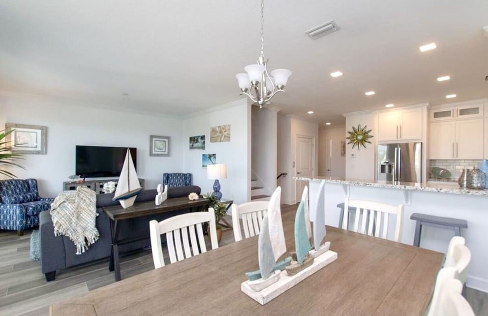 Open floor plan including kitchen, dining, and living room overlooks the canal