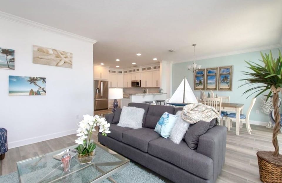Open floor plan including kitchen, dining, and living room overlooks the canal