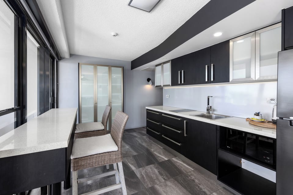 1 Bedroom Beachfront Apartment | Private kitchen | Coffee/tea maker, electric kettle