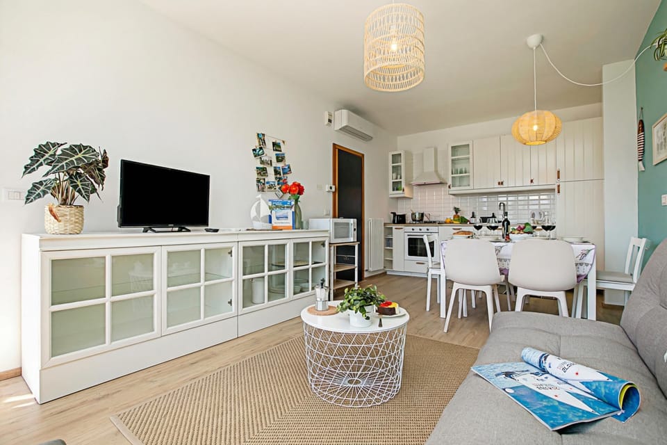 Family Apartment, 2 Bedrooms, Microwave, Mountainside (Casa Turchese with Private Garden,) | Living area | Flat-screen TV