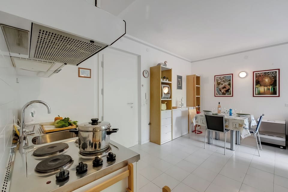 Family Apartment, Multiple Bedrooms, Lakeside (Residenza Lago D'Argento) | Private kitchen | Fridge, microwave, stovetop, coffee/tea maker