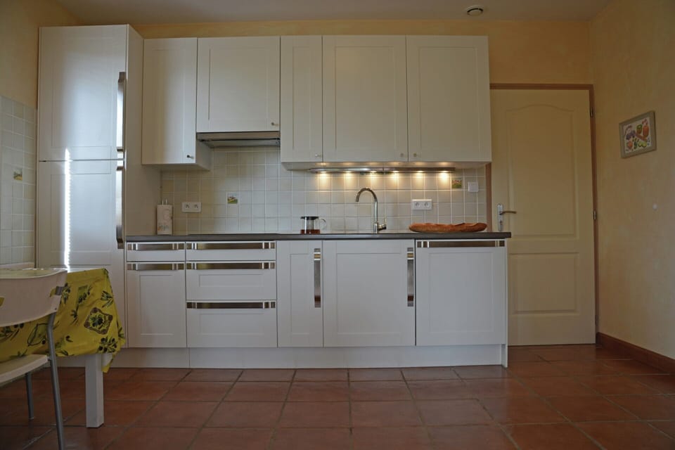Villa | Private kitchen | Fridge, microwave, stovetop, highchair