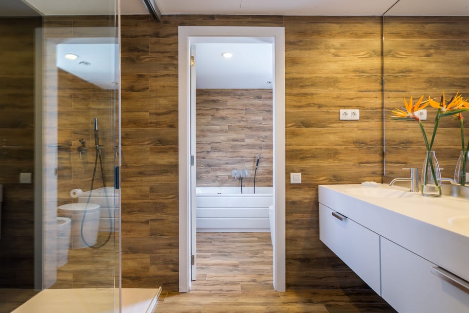 Suite (Atico Suite with Jacuzzi) | Bathroom | Rainfall showerhead, eco-friendly toiletries, hair dryer, towels