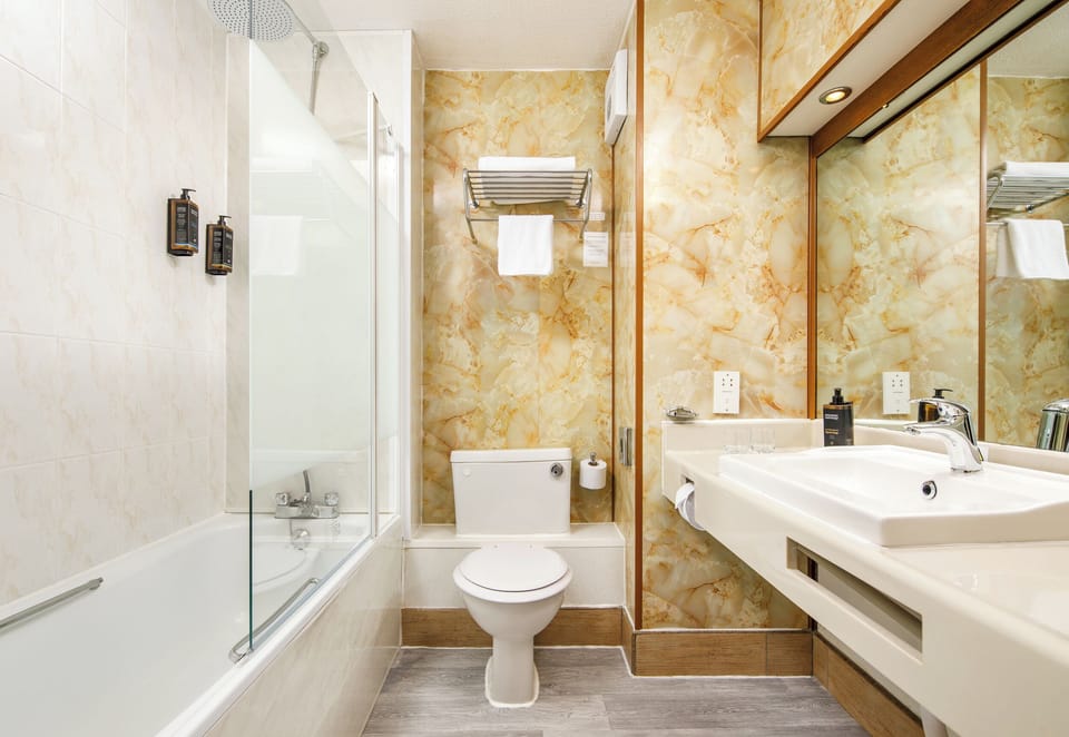 Eco-friendly toiletries, hair dryer, towels