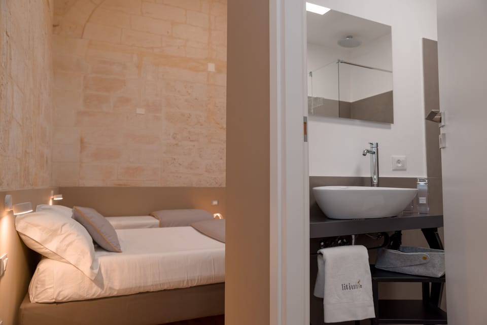 Deluxe Quadruple Room | Minibar, individually decorated, blackout drapes, soundproofing