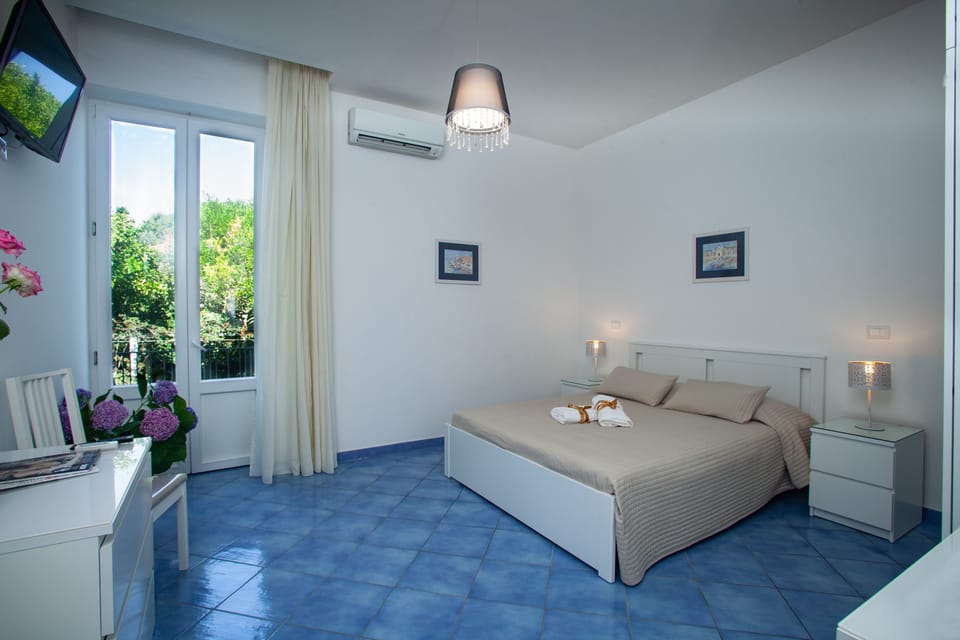 Triple Room, Balcony | In-room safe, individually furnished, desk, soundproofing