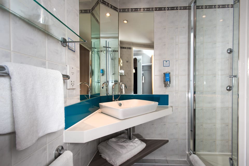 Shower, eco-friendly toiletries, hair dryer, towels