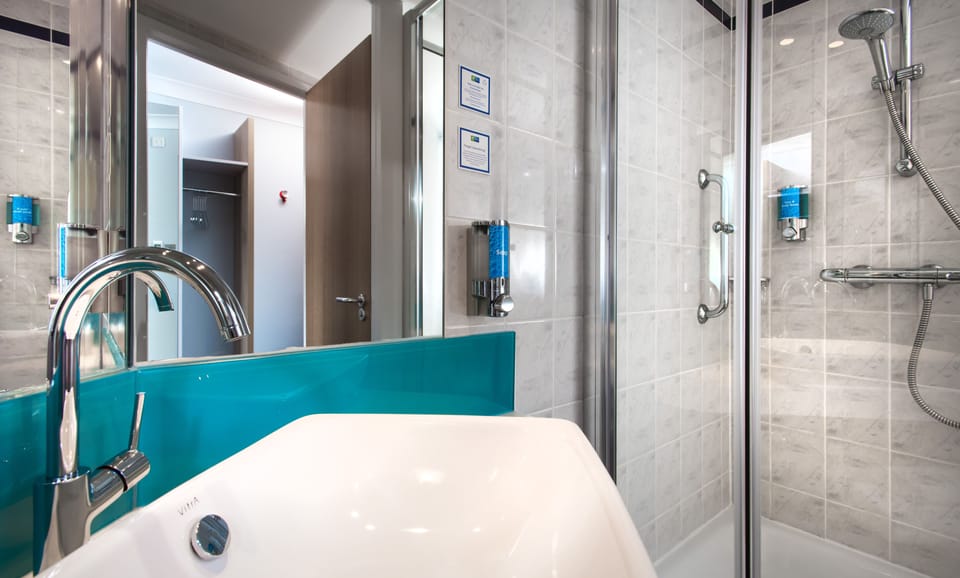 Shower, eco-friendly toiletries, hair dryer, towels