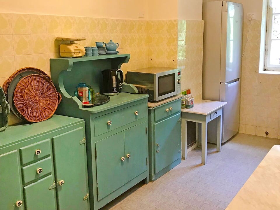 Room, Furniture, Turquoise, Cabinetry, Floor, Table, Interior Design, Kitchen, Building, Sideboard